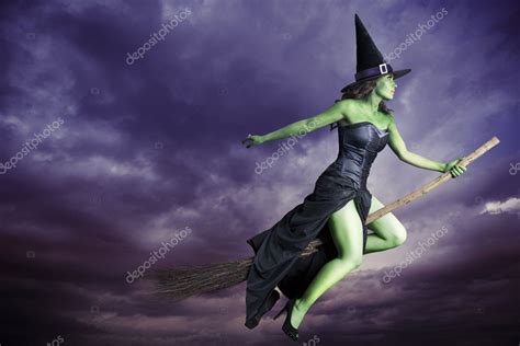 Halloween witch with a fiery broomstick ride
